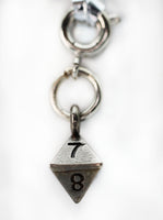 Traveler's Trinkets: D8 Charm